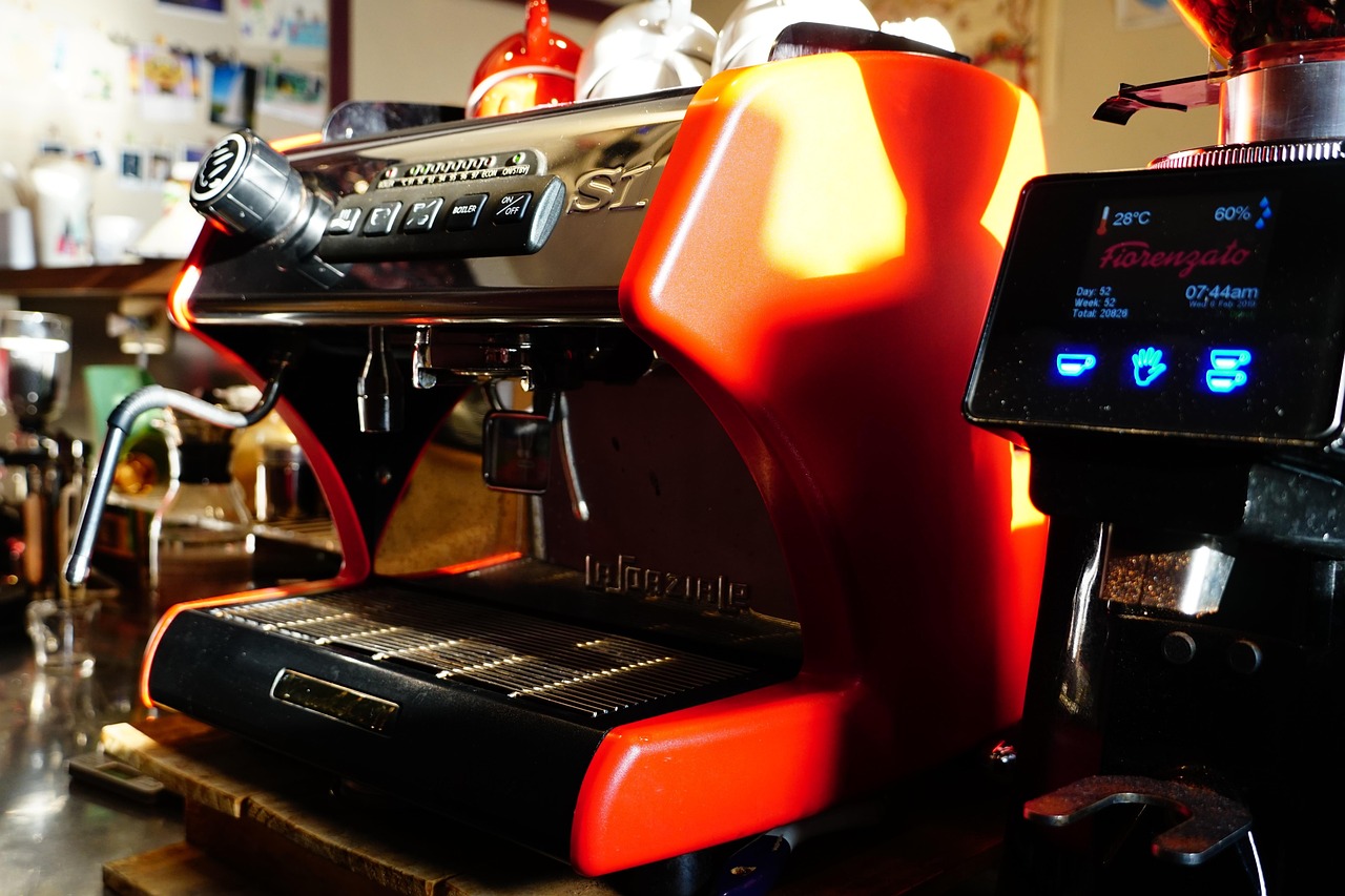A double shot of espresso pouring into a small cup